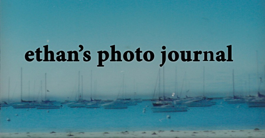 "Ethan's Photo Journal" old logo with old font, over a slide with boats and water.