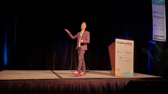 rand fishkin making some hand gesture on stage