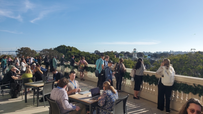 outside on the patio overlooking seaport village and trees