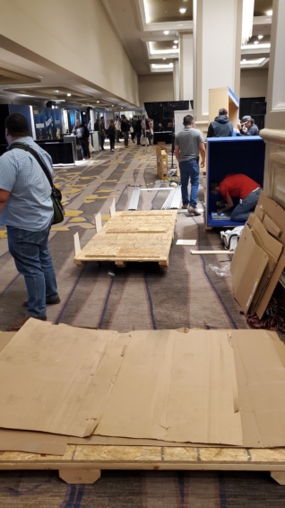 cardboard and wood pallets disassembling the vendor hallways