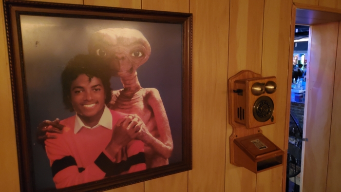 michael jackson, ET the extraterrestrial, and an antique wooden phone