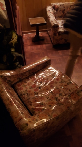 a matching old floral chair in a shiny plastic case