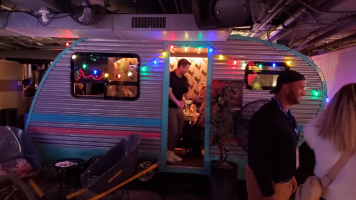 a side room for talking and drinking in a trailer in the basement with authentic grandma table