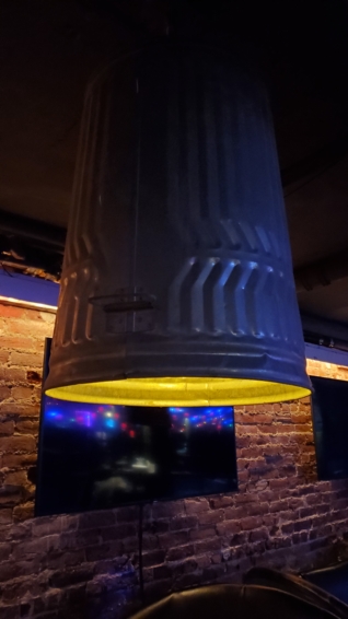 metal garbage cans hung upside down for lights